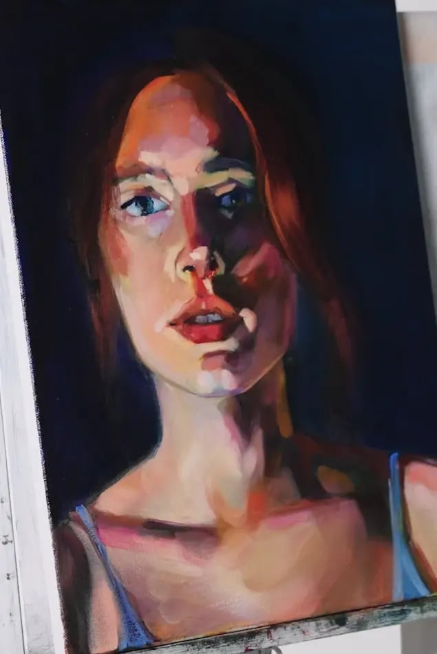 The oil portrait of a woman with red hair late in step 3, painted in bold planes of color with the brushstrokes left visible