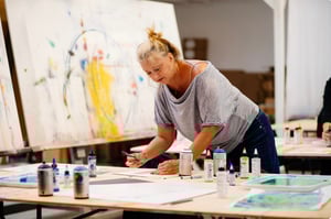 Woman Artist Working at Table on Art 