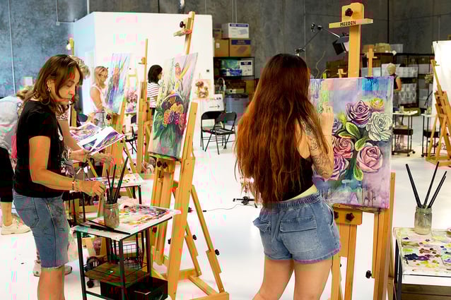 Classroom with artist working at easels