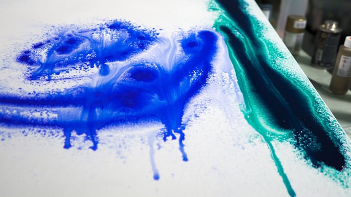 Blue acrylic paint dripping