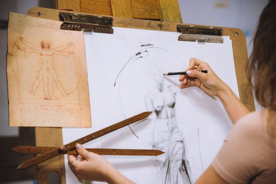 Dimitra Milan demonstrating proportion measuring in art