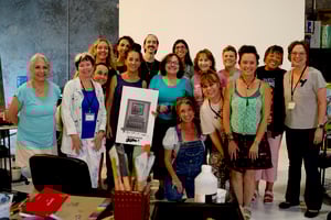 Group of artist standing together in gallery