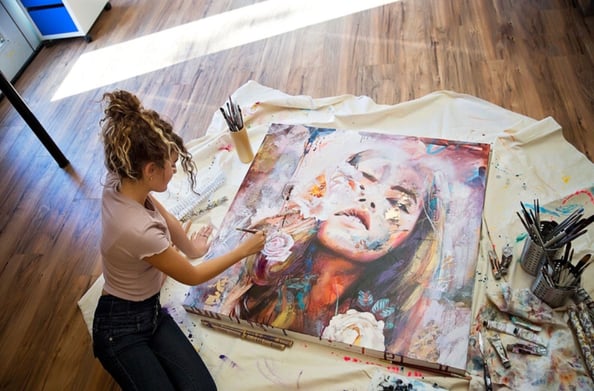 Dimitra Milan painting a portrait