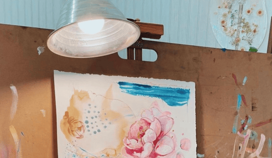 clamp light above paper painting