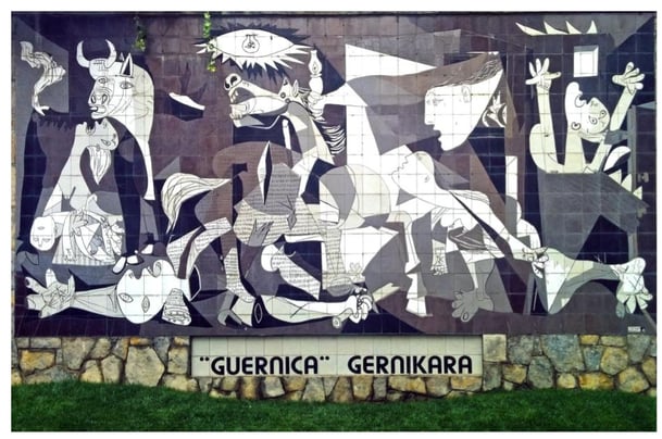 Pablo Picasso painting gray black and white faces animals, Photo caption: “Guernica” by Pablo Picasso. Photo by Almudena Sanz from Pixabay.