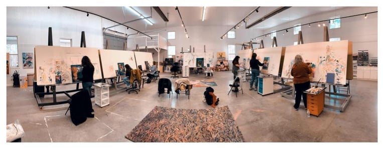 Milan Art Institute students painting  on large easels