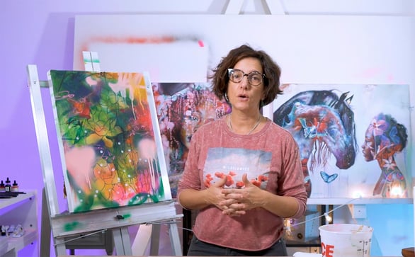 Women standing in front of horse and flower painting