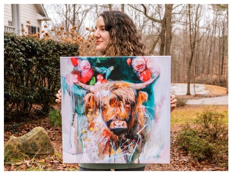 girl with painting of flowers and cow pink and teal