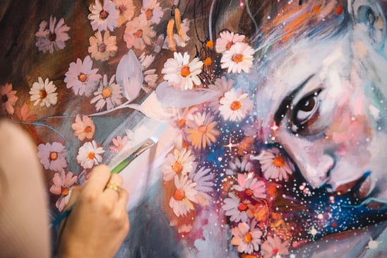person painting Painting face with flowers