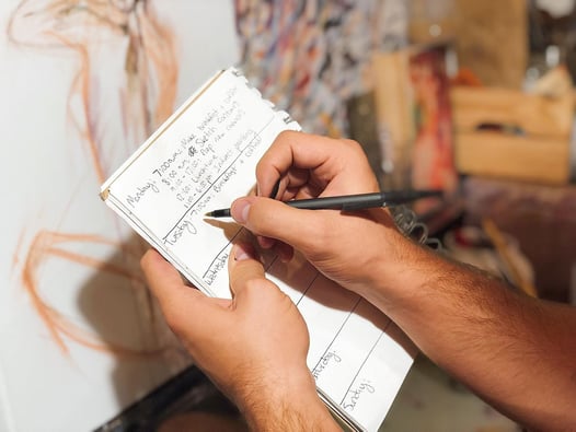Photo caption: Art students and professional artists alike need good time management habits, like keeping a to-do list, if they want to succeed in their art careers.