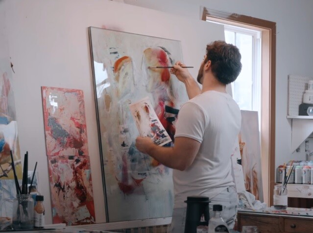 man painting on Glass Start to Finish red orange