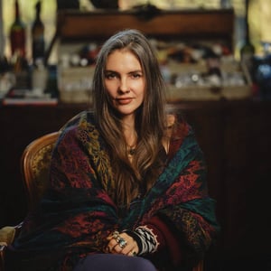 Woman sitting in front of art desk