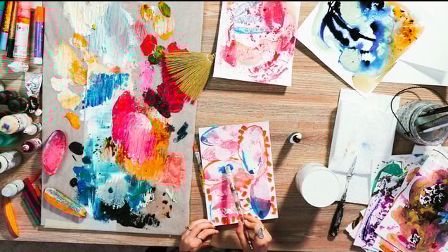 overhead shot of pallet with paint blue red white yellow