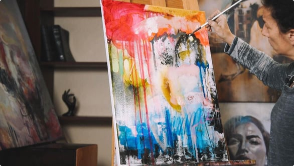 woman painign abstract painting blue red white yellow