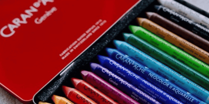 Colorful pastels in metal red tin