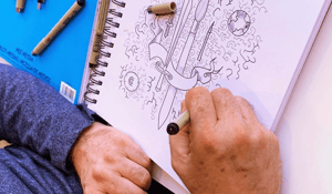 Hnads sketching in sketch book