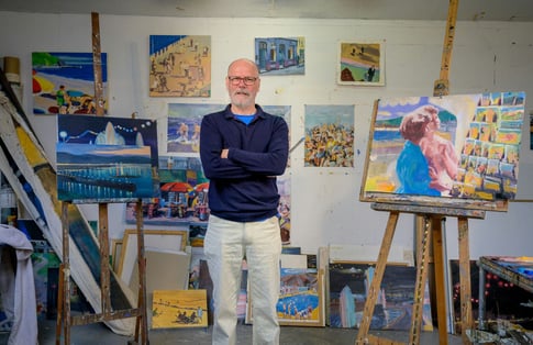 Artist with his work