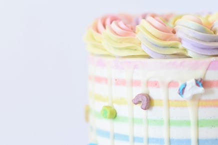 Rainbow decorated cake Photo by Deva Williamson on Unsplash