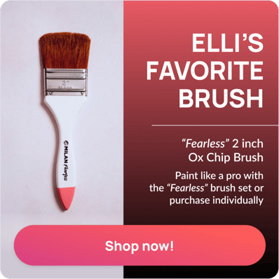 paint brush wiht white handle 