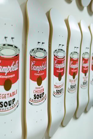 white skateboards with cambels soup labels painted