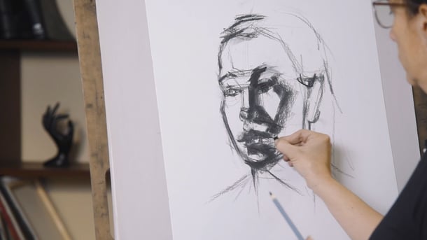 hand drawing a portrait