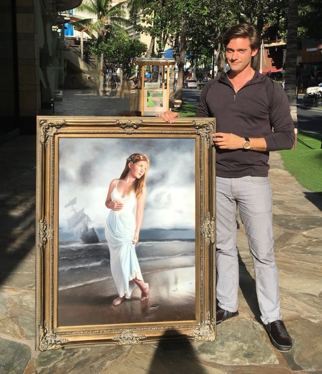 jock standing in front of framed painting of girl on beach in white dress