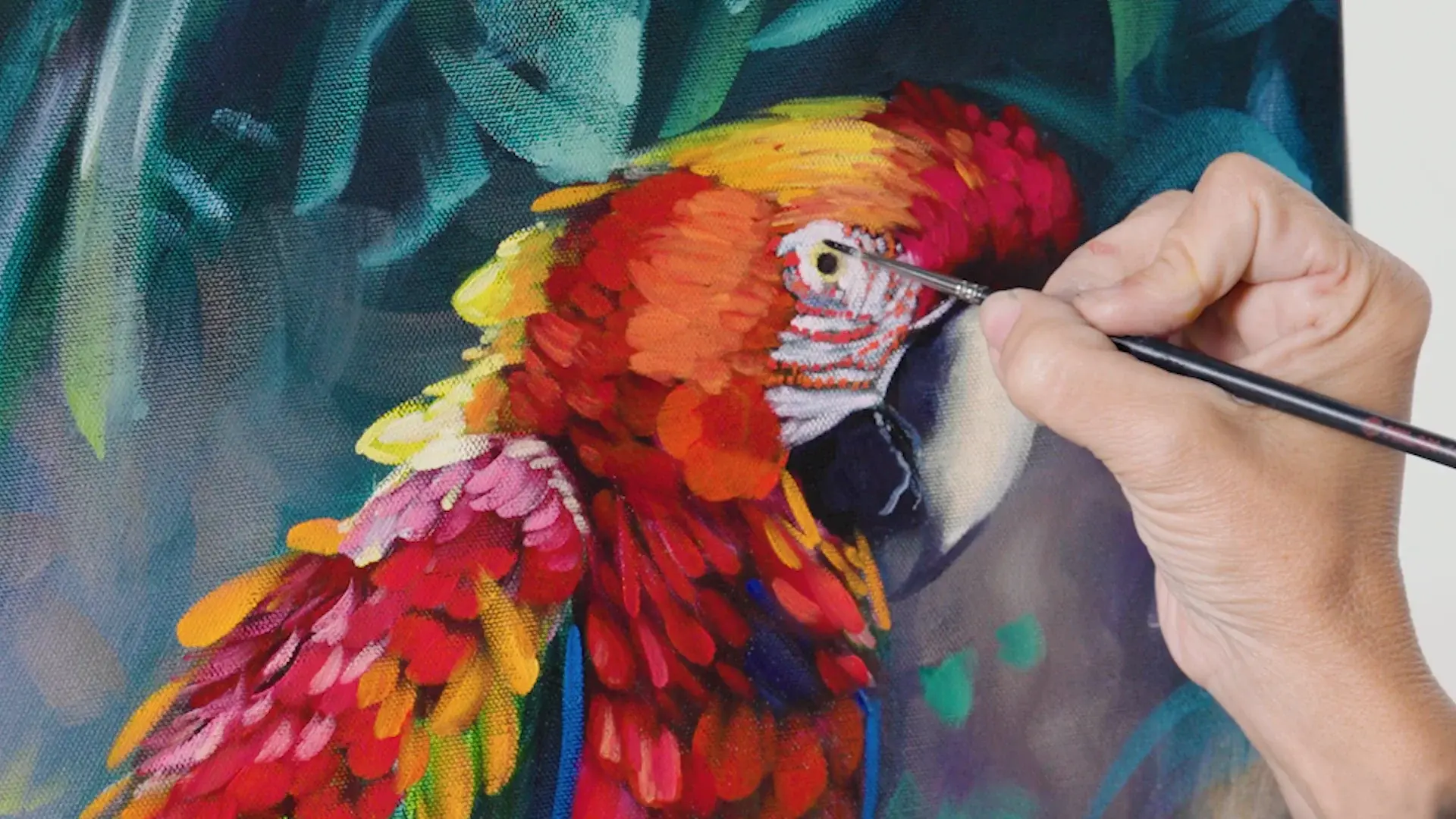 A fine brush placing the last highlight in the finished parrot's eye