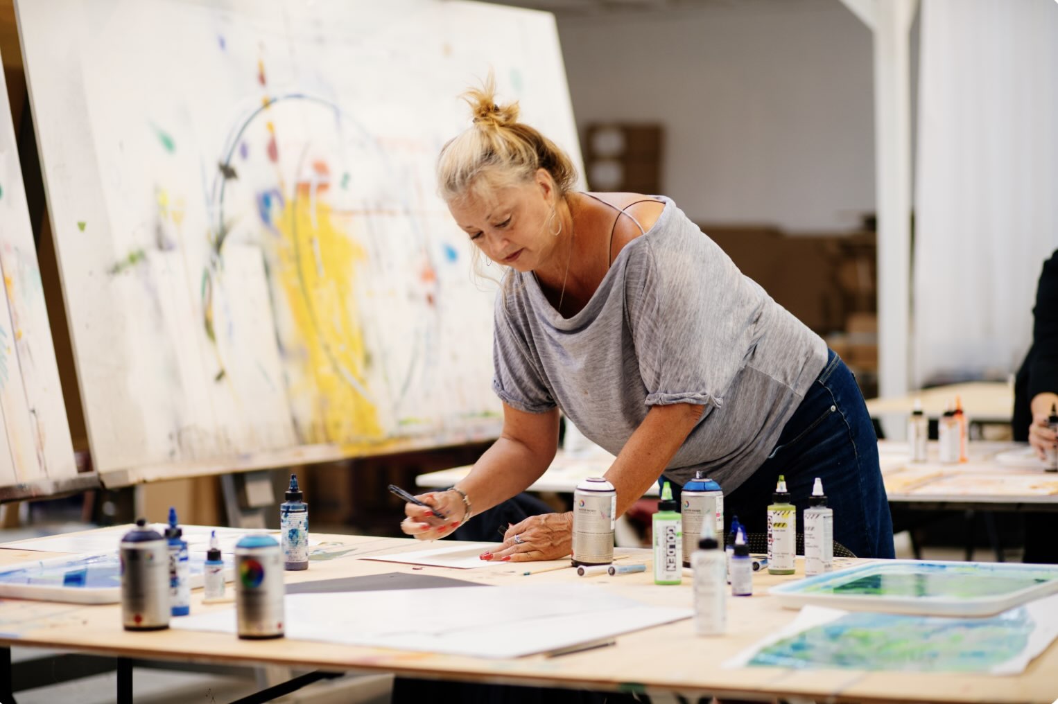 Woman Artist Working at Table on Art