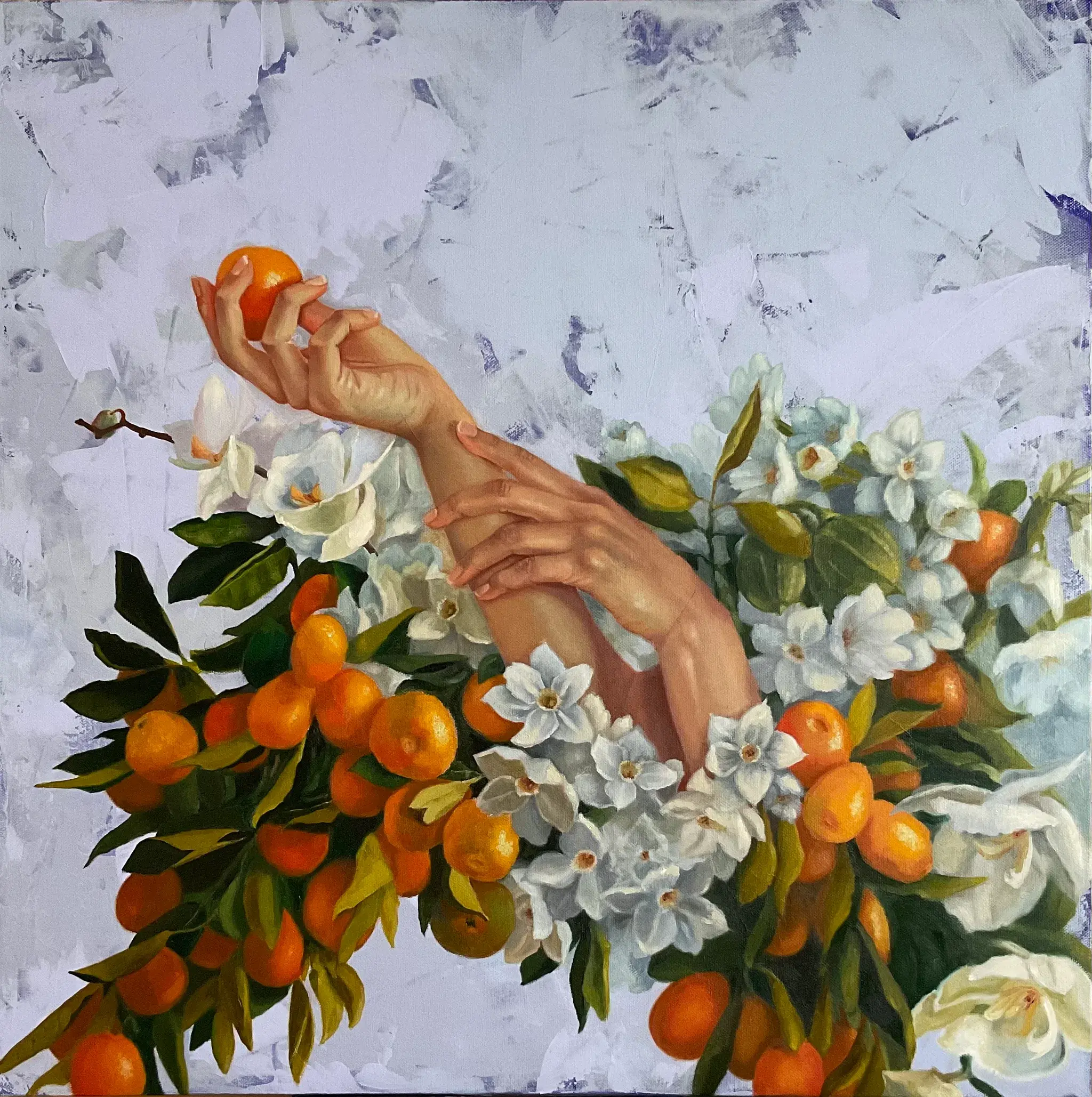 Hands holding oranges surrounded by oranges
