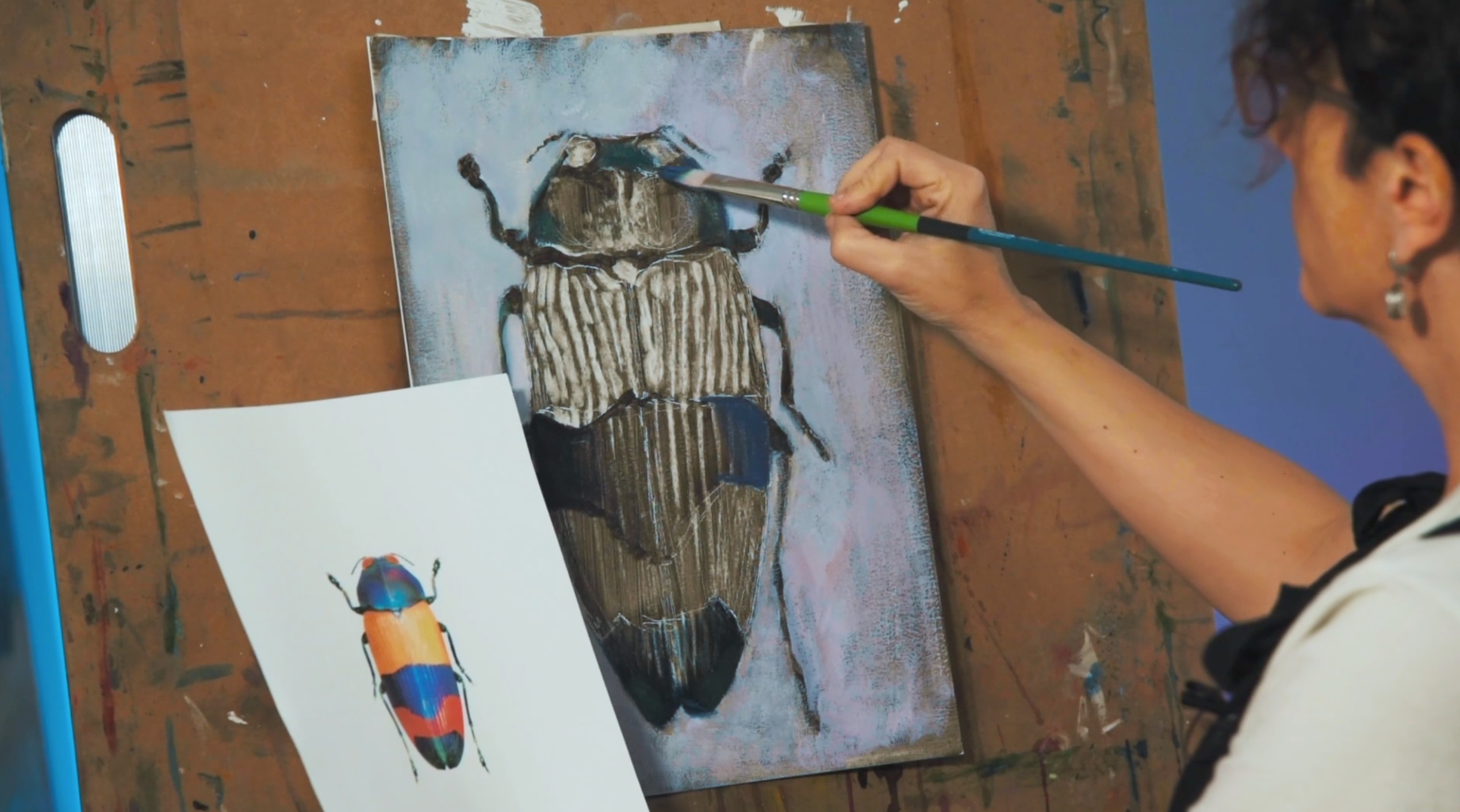 hand painting a Beatle 