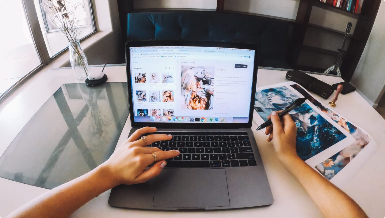 Hands in front of a computer
