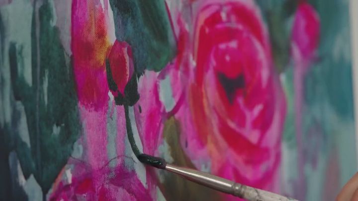 Dimitra Milan painting the acrylic floral at her easel